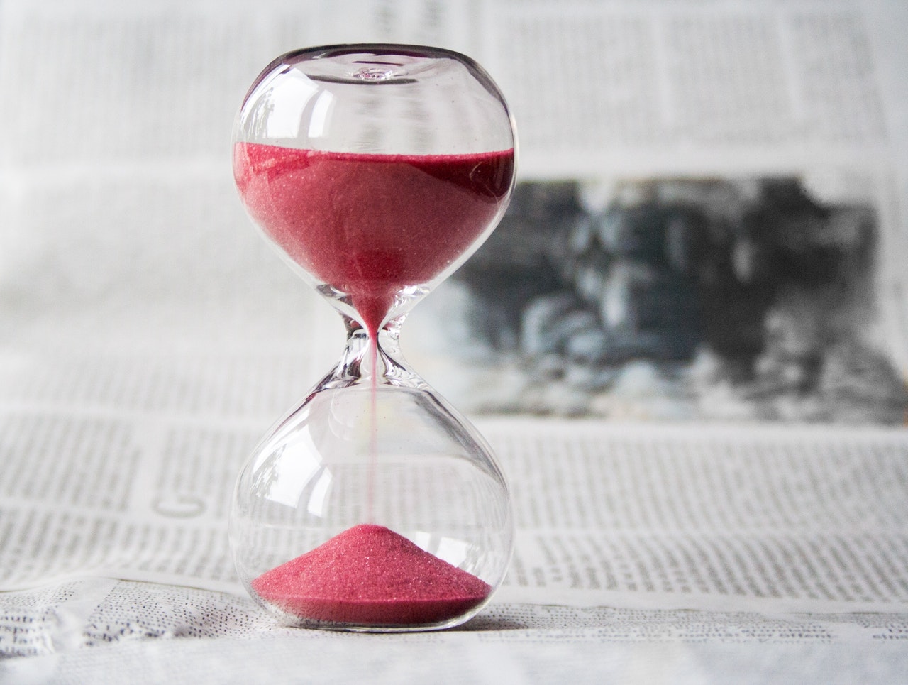 Logical Hiring follows punctuality at work. Image of an Hour glass.